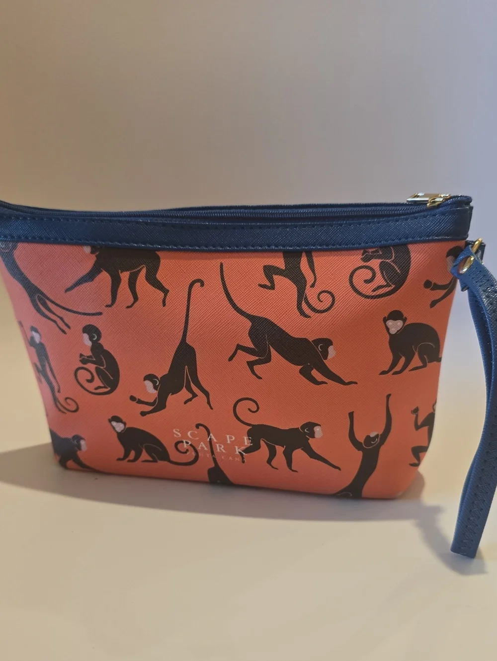 Scape Park Orange Wristlet Pouch with Navy Trim and Black Monkey Print